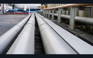 Photo of pipelines lined up in a row.
